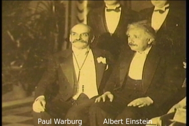 Paul Warburg, founder of the 1913 Federal Reserve Bank, presents Albert Einstein (see e.g. The Money Masters (c)1997 Documentary by Patrick S.J. Carmack, B.B.A., J.D. William S. Still & Robert Krueger, Rick James)